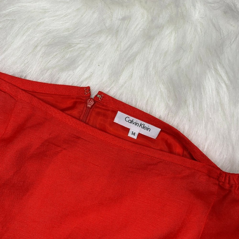 Calvin Klein Red Skirt Size 14 Zips up in back.